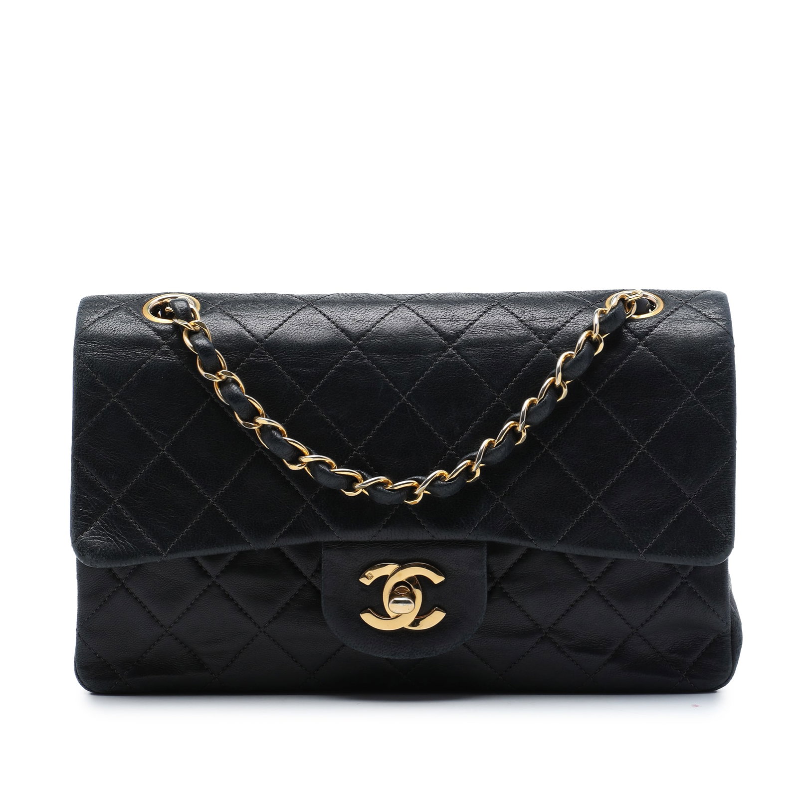 Chanel Small Classic Double Flap Shoulder Bag in Black Lambskin: Chanel Small Classic Double Flap Shoulder Bag in Black Lambskin A Chanel Small Classic Lambskin Double Flap shoulder bag crafted in black quilted lambskin leather. It features leather-woven chain link