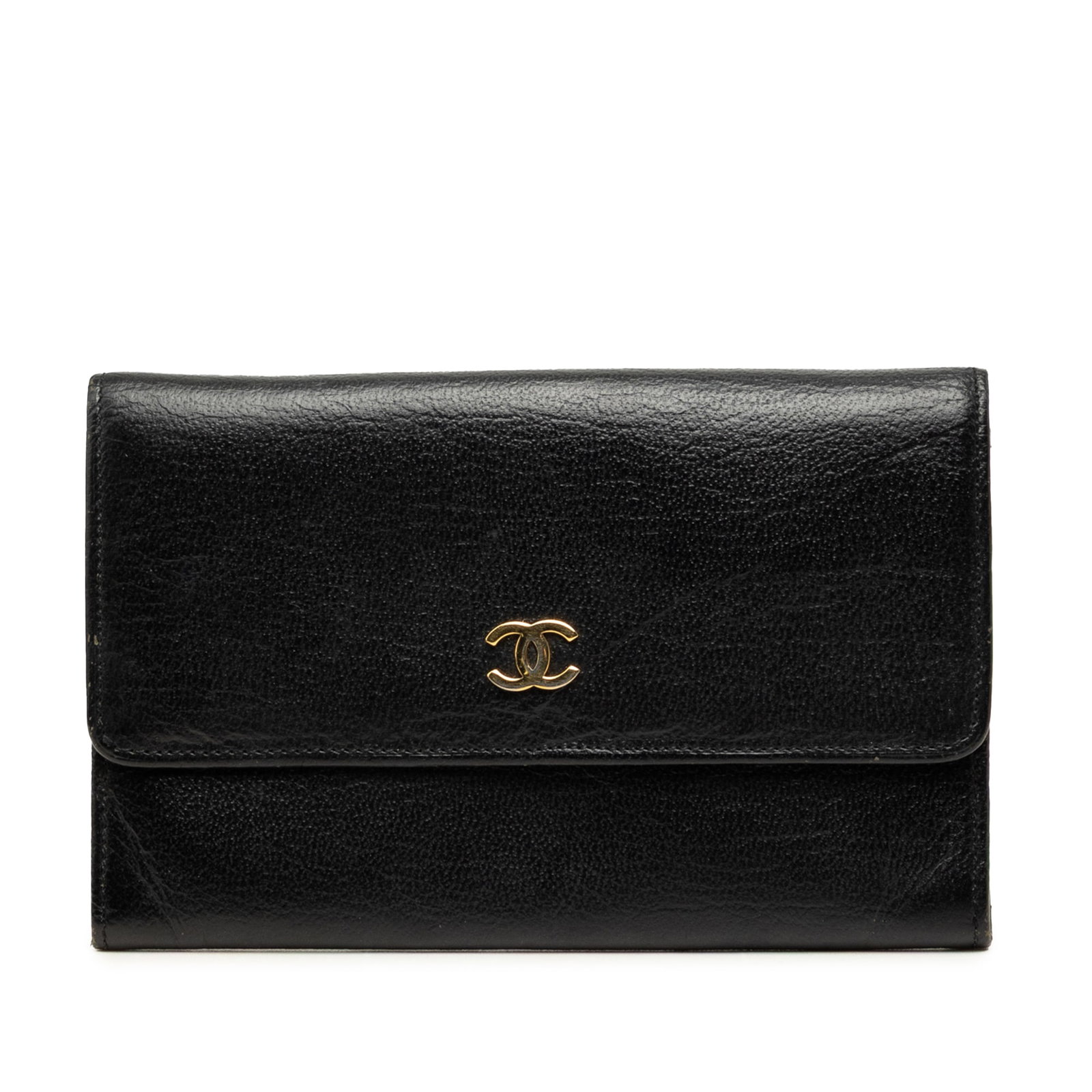 Black Leather Passport Holder Chanel CC Calfskin: Black Leather Passport Holder Chanel CC Calfskin Chanel CC calfskin passport cover in black leather with a snap button closure. Includes the box and card. Condition is B+ with visible wear including s