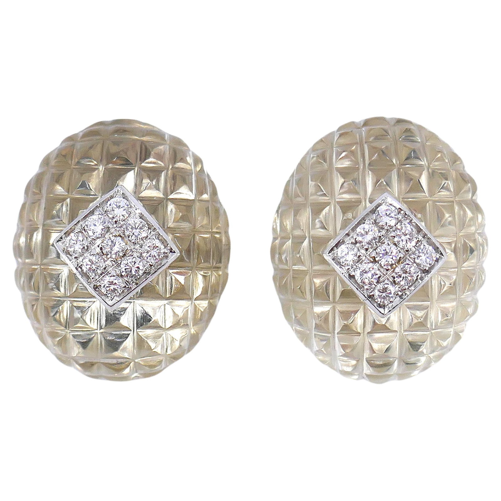 Van Cleef Arpels clip-on earrings in 18k gold with carved crystal diamonds: Van Cleef Arpels clip-on earrings in 18k gold with carved crystal diamonds Vintage clip-on earrings by Van Cleef & Arpels, featuring carved crystal and diamonds set in 18k gold. The earrings are descr