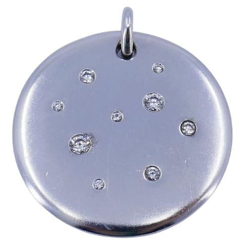 Tiffany & Co. Diamond Disc Pendant in 18k White Gold: Tiffany & Co. Diamond Disc Pendant in 18k White Gold Vintage Tiffany & Co. disc pendant in 18k white gold, set with 9 round brilliant diamonds totaling 0.15 carats. The pendant is signed Tiffany & Co.