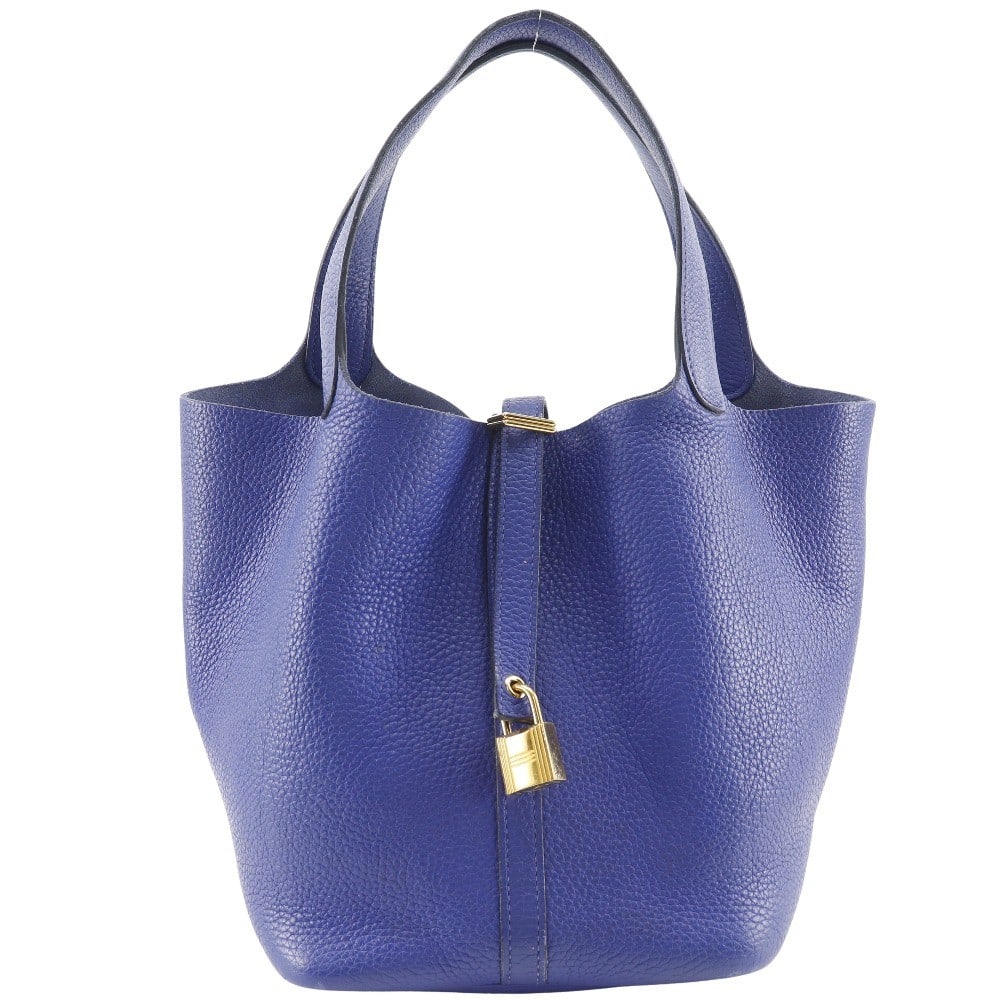 Blue Leather Handbag Hermes Picotin Lock 22cm x 22cm x 17cm: Blue Leather Handbag Hermes Picotin Lock 22cm x 22cm x 17cm The Hermes Picotin Lock Bag is crafted from blue leather and designed for women. This bag features a spacious interior and signature lock cl