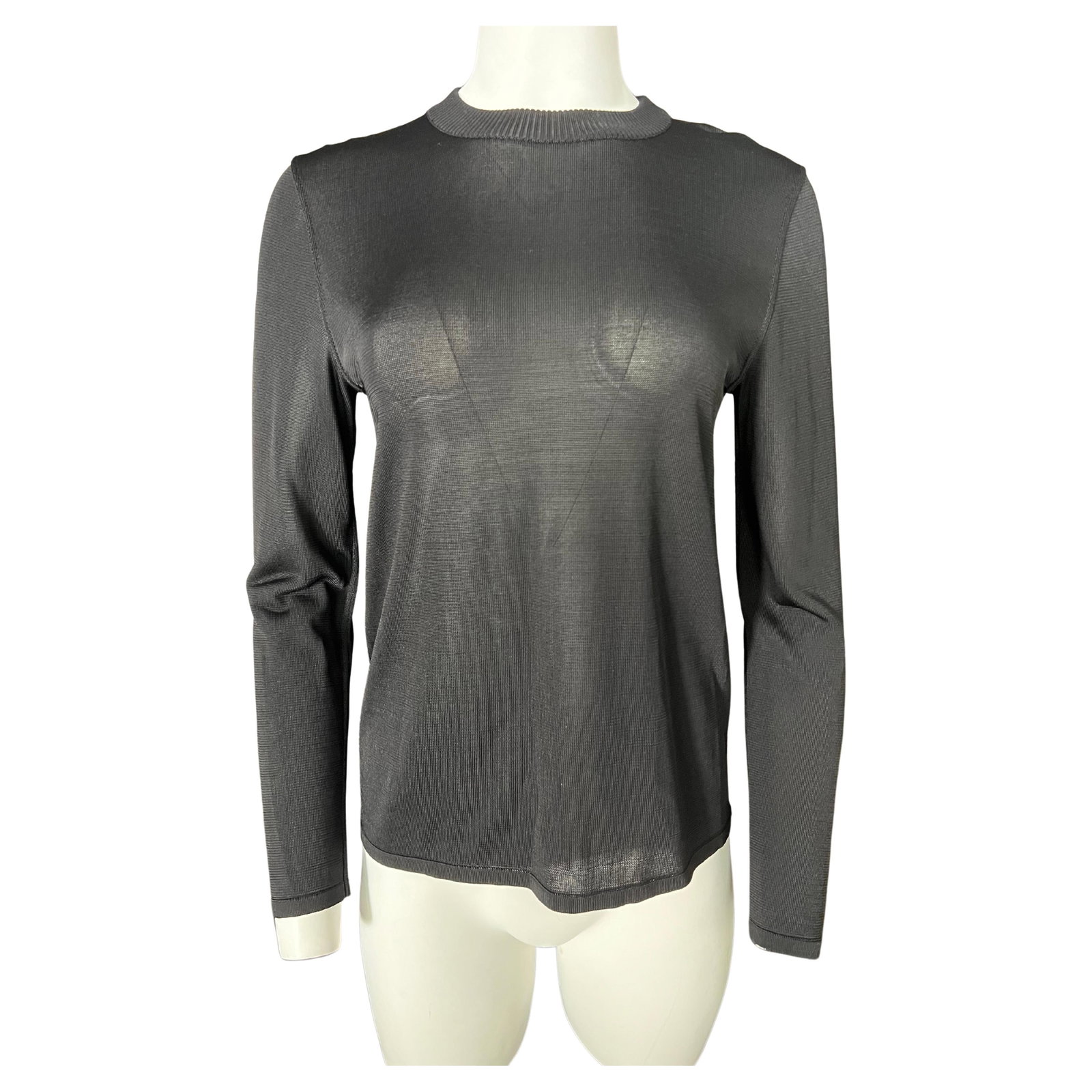 Azzedine Alaia XS Black Knit Sheer Long Sleeve Top: Azzedine Alaia XS Black Knit Sheer Long Sleeve Top A black Alaia top by Azzedine Alaia, made in Italy. It features a knit, see-through finish, long sleeves, and a crew neckline. The piece is marked si
