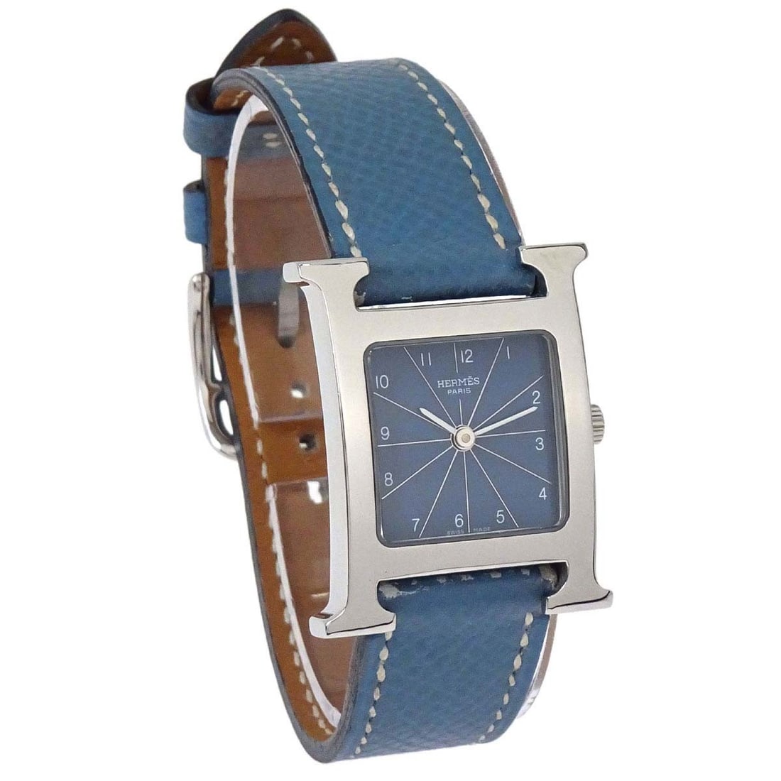 Hermes H Watch HH1.210 25mm Quartz Wristwatch Blue Jean: Hermes H Watch HH1.210 25mm Quartz Wristwatch Blue Jean Hermes H Watch quartz wristwatch for women with the signature H-shaped case design. This analog Swiss-made watch features a white dial, gold-ton