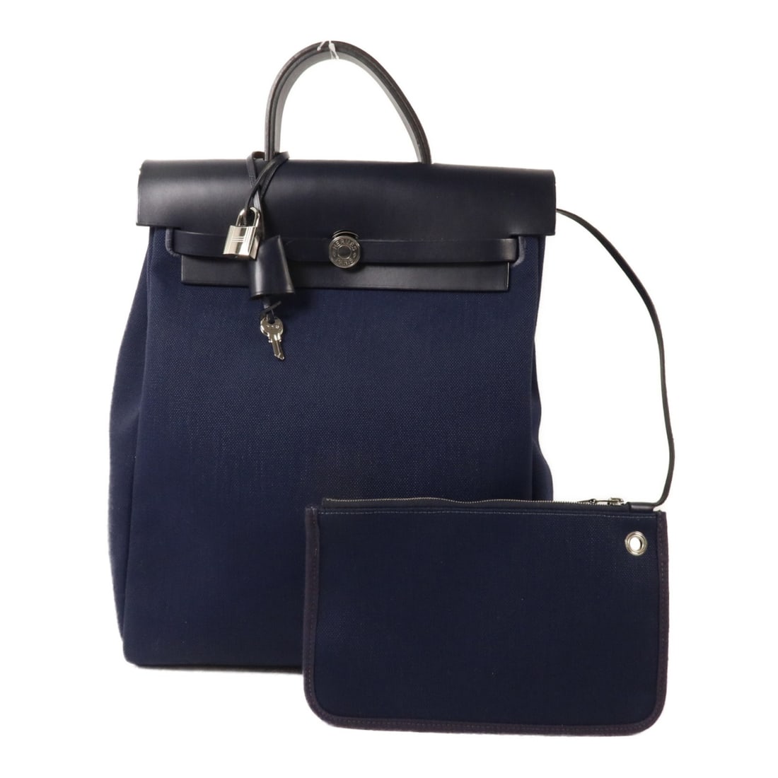 Hermes Herbag a Dos Zip Retourne Canvas Backpack Bleu Indigo PHW: Hermes Herbag a Dos Zip Retourne Canvas Backpack Bleu Indigo PHW Hermes Herbag a Dos Zip Retourne backpack in Bleu Indigo canvas with palladium-tone hardware. This women's rucksack-style bag is made i