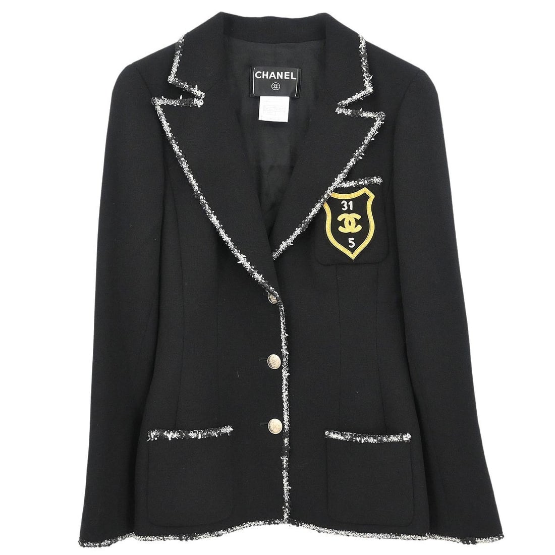 Chanel 05C Black Wool Collared Jacket with Emblem Size 36: Chanel 05C Black Wool Collared Jacket with Emblem Size 36 Vintage Chanel single-breasted jacket in black wool with a collared design and logo accents. This women's mid-length jacket features long slee