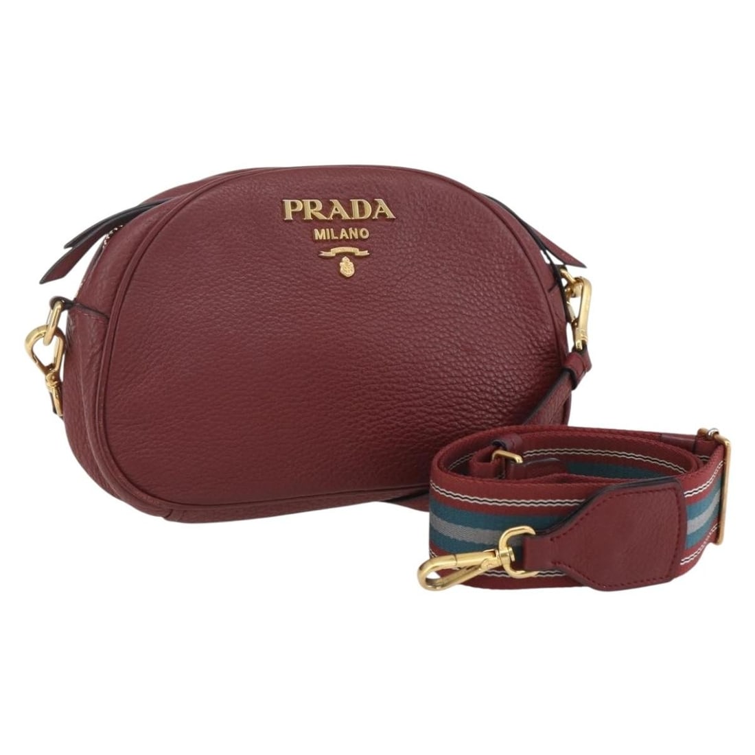 Prada Dual Strap Burgundy Leather Crossbody Bag: Prada Dual Strap Burgundy Leather Crossbody Bag This Prada Dual Strap Crossbody Bag is crafted from burgundy leather and designed for women. It features dual shoulder straps and metal fittings. The ba