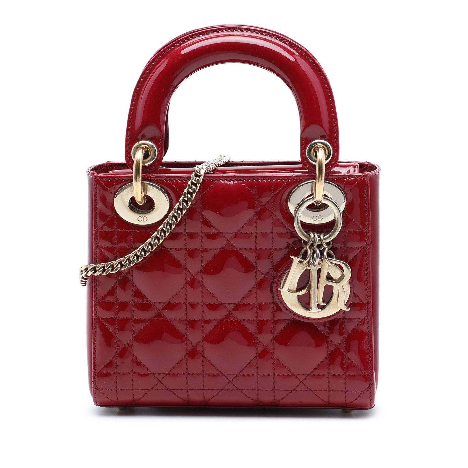 Dior Lady Dior Mini red patent leather handbag: Dior Lady Dior Mini red patent leather handbag A Mini Patent Cannage Lady Dior handbag in red patent leather with quilted detailing. This bag features flat top handles, a detachable flat leather
