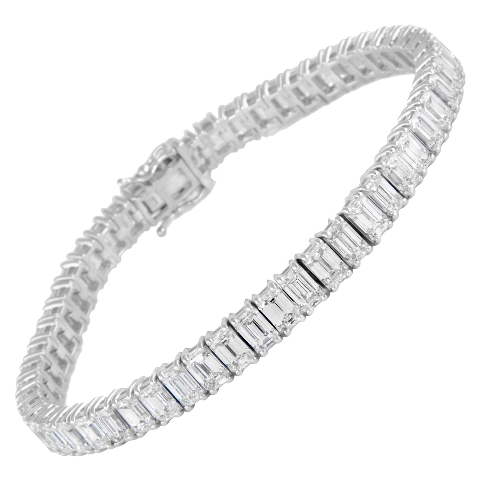 18k White Gold Diamond Tennis Bracelet 17.10ct Emerald Cut: 18k White Gold Diamond Tennis Bracelet 17.10ct Emerald Cut Contemporary emerald cut diamond tennis bracelet set with 52 white diamonds totaling 17.10 ct. Crafted in 18k white gold, this straight-line 