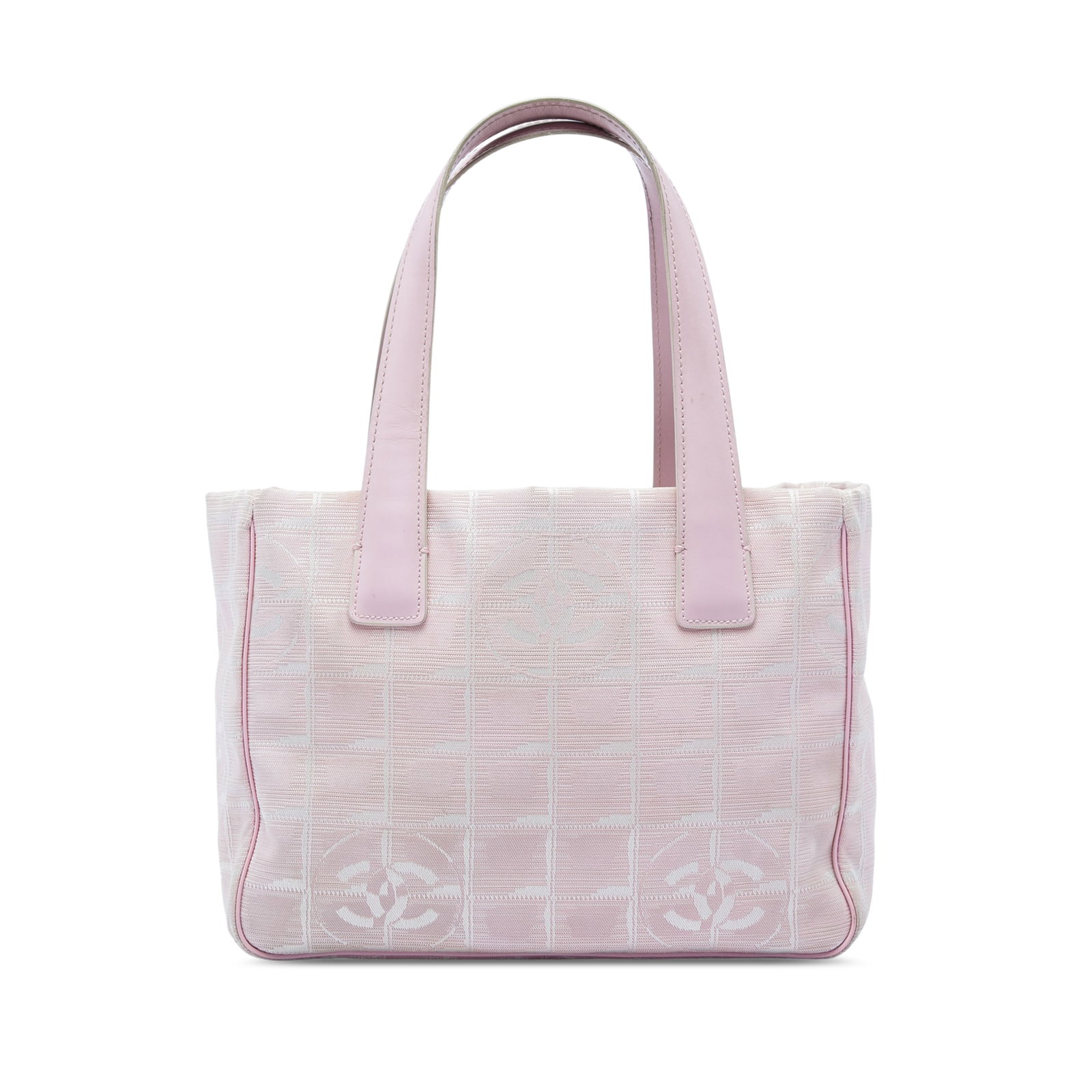 Chanel New Travel Line Pink Nylon Tote Bag: Chanel New Travel Line Pink Nylon Tote Bag A Chanel New Travel Line tote in pink nylon with flat leather handles, an open top, and interior zip pockets. Made in France, this bag shows visible wear and