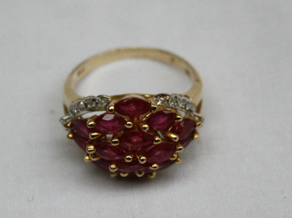 Size 7 French 14K Yellow Gold Ruby and Diamond Ring: Size 7 French 14K Yellow Gold Ruby and Diamond Ring French-made 14k yellow gold ring set with diamonds and pink rubies. This pre-owned ladies ring features detailed design work and is fully signed and