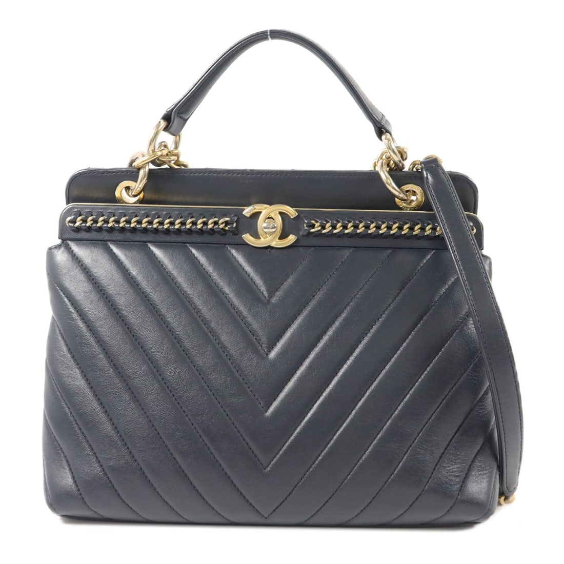 CHANEL CC 2 Way Shoulder Bag Navy Calfskin Chevron V Stitch: CHANEL CC 2 Way Shoulder Bag Navy Calfskin Chevron V Stitch Chanel 2-way shoulder bag in navy calfskin leather with a chevron V-stitch design and CC turn-lock closure. Made for women, this bag include