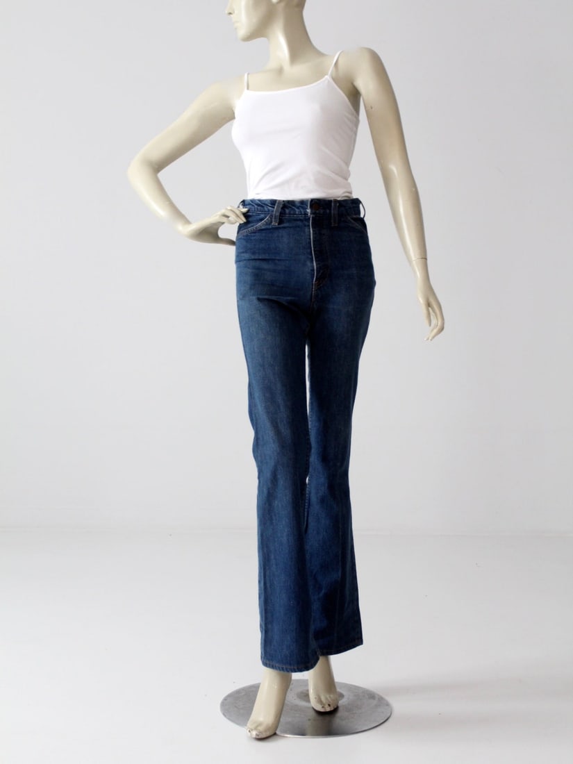 Vintage 70s Levi's High Waist Flare Leg Jeans 29 x 33: Vintage 70s Levi's High Waist Flare Leg Jeans 29 x 33 Embrace the timeless style of the 70s with these vintage Levi's flare leg jeans. Featuring a sleek dark wash and a flattering high waist, these sl