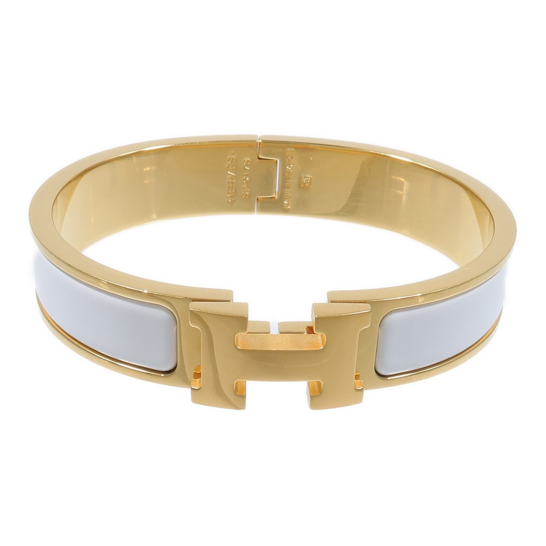 Hermes Clic H enamel bracelet white and gold tone: Hermes Clic H enamel bracelet white and gold tone Hermes Clic H bracelet in white enamel and metal with a gold-tone and white color combination. Designed for women, this bracelet is made in France and