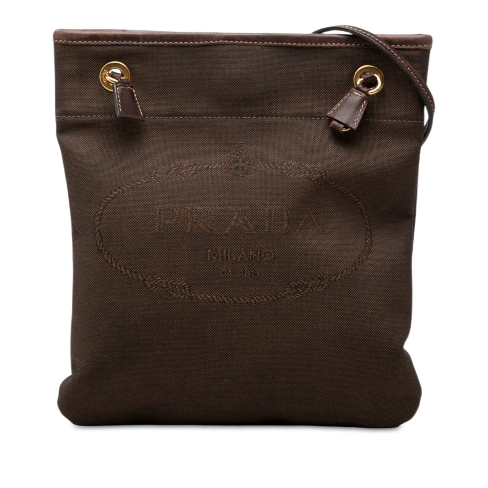 Prada Canapa Logo Canvas Crossbody Bag Brown: Prada Canapa Logo Canvas Crossbody Bag Brown Prada Canapa Logo crossbody bag crafted in canvas with leather trim. It features a flat leather strap, an open top with magnetic snap closure, and an inter