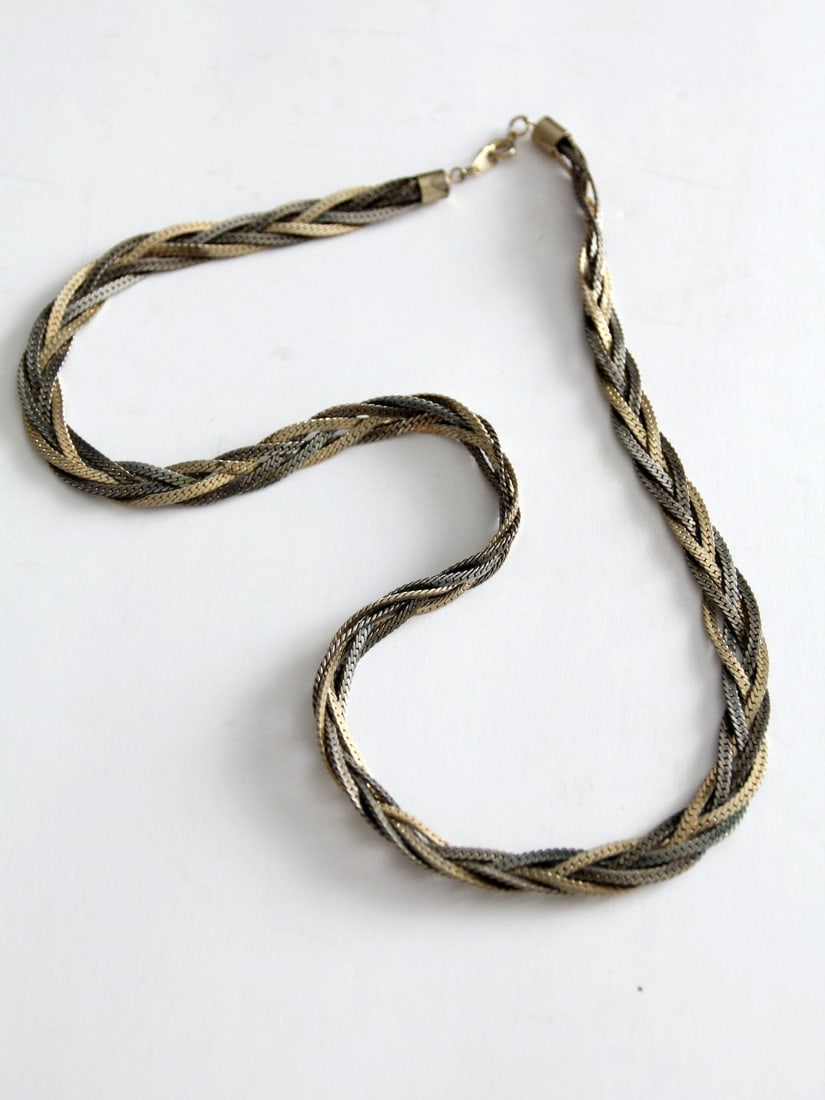 Vintage Braided Chain Necklace Gold Silver Tone 24 Inch: Vintage Braided Chain Necklace Gold Silver Tone 24 Inch This vintage braided chain necklace showcases a stylish combination of gold and silver tone chains intricately braided together. It features a s
