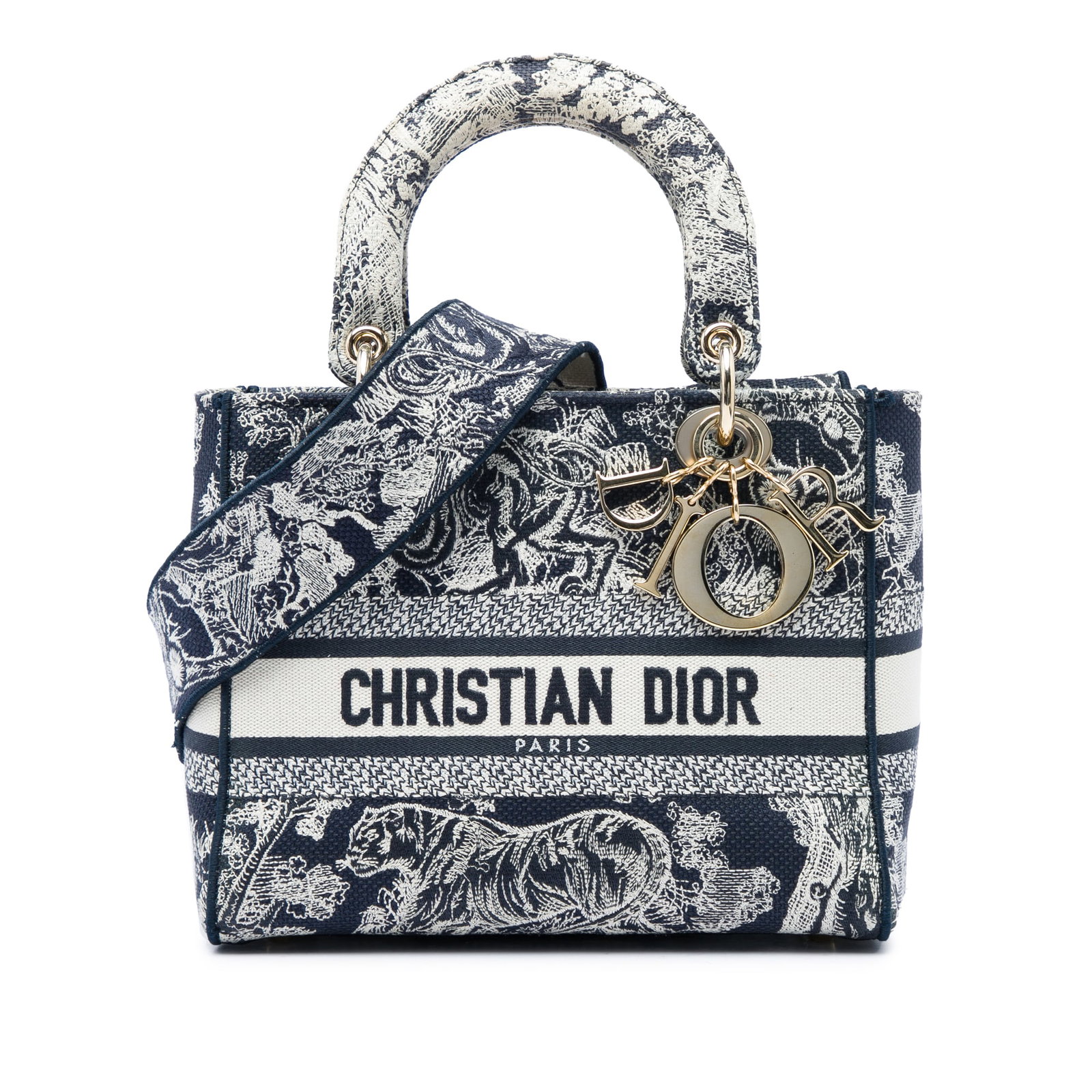 Dior Lady D Lite Medium Blue Toile de Jouy Canvas Bag: Dior Lady D Lite Medium Blue Toile de Jouy Canvas Bag The Lady D-Lite is crafted in embroidered canvas with the Toile de Jouy motif and a structured silhouette. It features flat embroidered canvas han