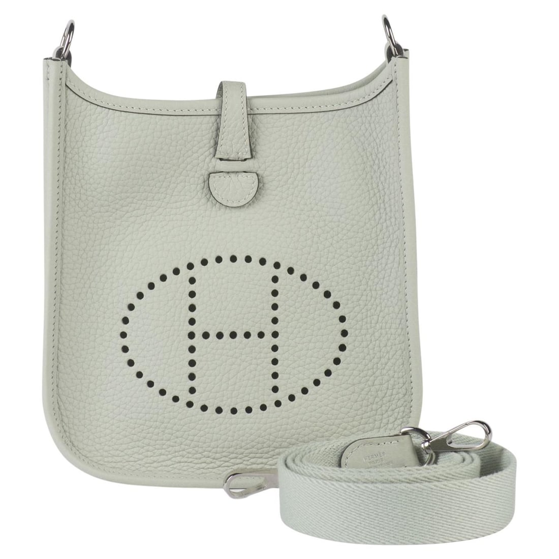 Hermes Mini Evelyne Grey Pearl Leather Shoulder Bag: Hermes Mini Evelyne Grey Pearl Leather Shoulder Bag This Hermes Mini Evelyne Bag is crafted from grey pearl leather and features the signature perforated logo detail. It includes an adjustable shoulde