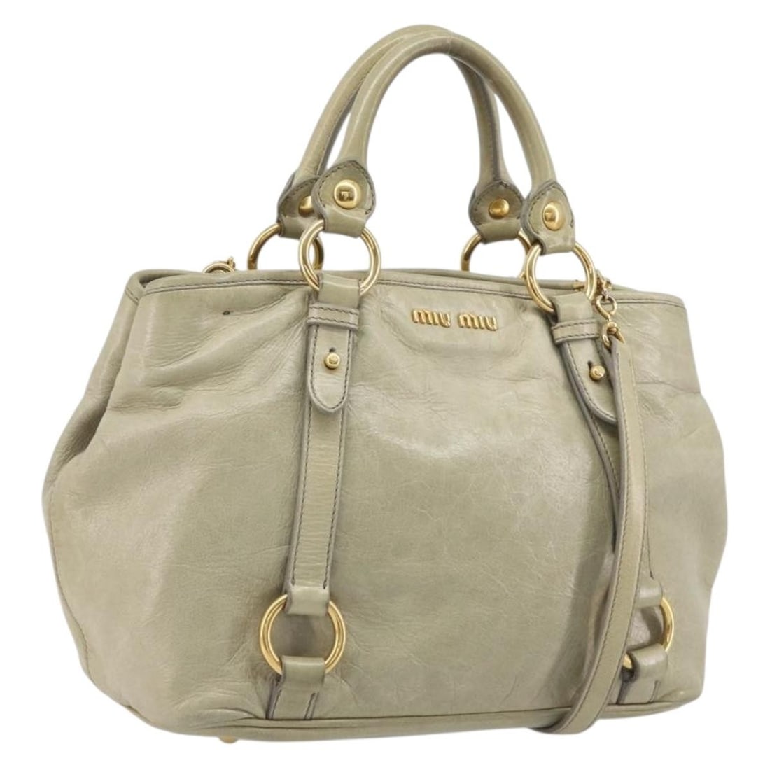 Miu Miu Beige Leather 2way Handbag with Shoulder Strap: Miu Miu Beige Leather 2way Handbag with Shoulder Strap Miu Miu 2-way handbag in beige leather with gold-tone accents. Designed for women, this handbag includes a top handle and a detachable shoulder s