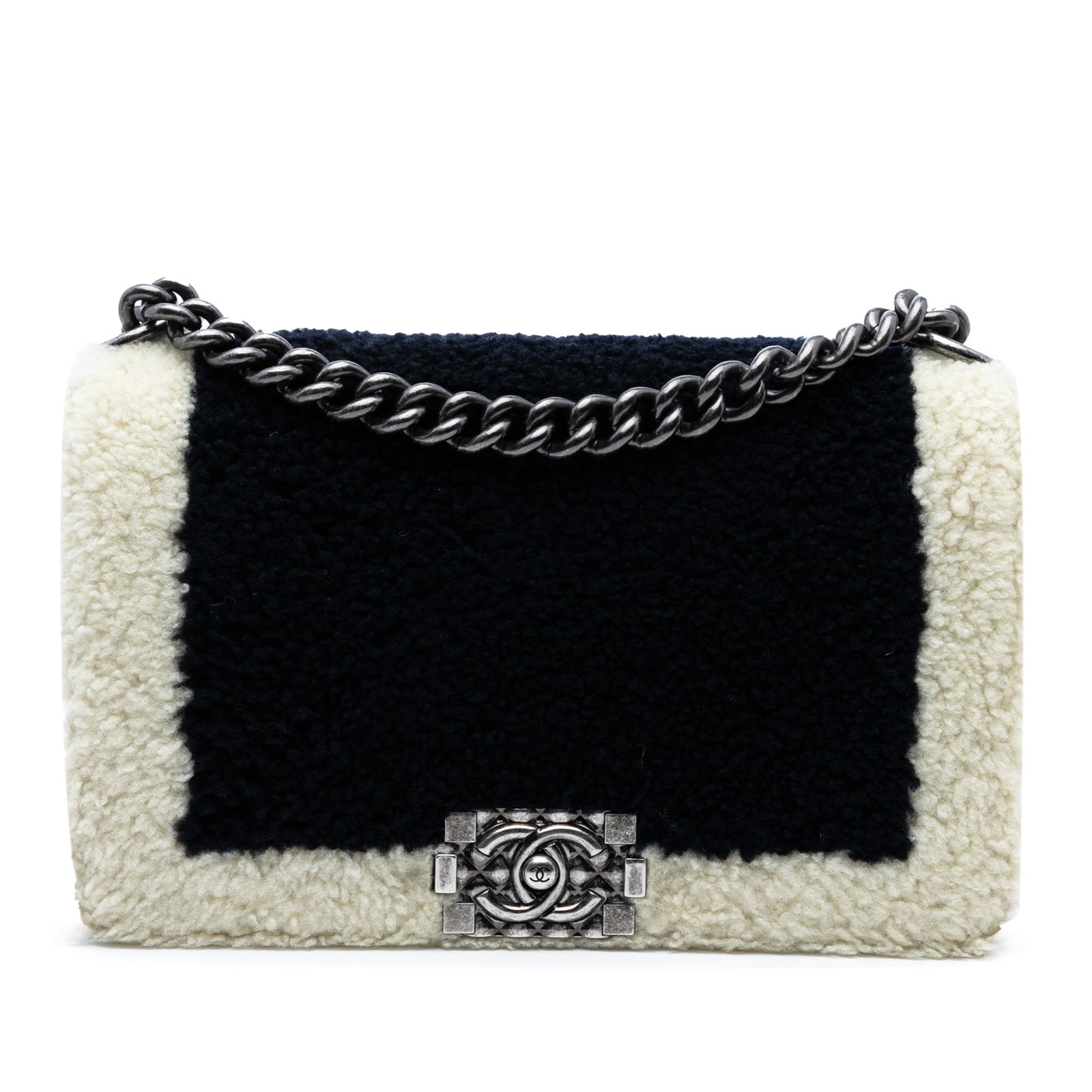 Chanel Boy Flap Medium bicolor shearling shoulder bag: Chanel Boy Flap Medium bicolor shearling shoulder bag This Chanel Old Medium Bicolor Shearling Boy Flap bag showcases a luxurious design with a soft fur body complemented by leather trim. It features 
