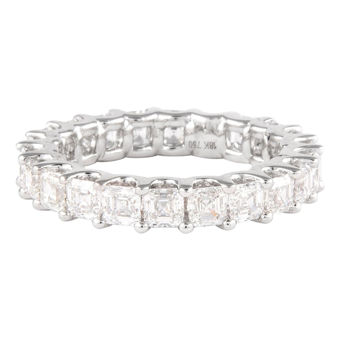18k White Gold Eternity Ring 3.39ct Asscher Diamond D E VVS: 18k White Gold Eternity Ring 3.39ct Asscher Diamond D E VVS Asscher cut diamond eternity band set with 22 diamonds totaling 3.39 ct. The ring is crafted in 18k white gold and features D/E color, VVS c
