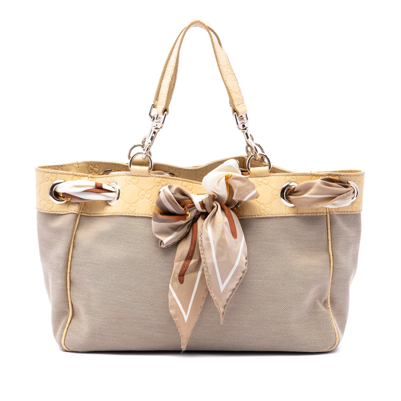 Gucci Positano Medium Canvas Tote with Guccissima Leather Trim: Gucci Positano Medium Canvas Tote with Guccissima Leather Trim This Gucci Positano tote is crafted with a canvas body and embossed leather trim, finished with flat leather straps and an open top with 