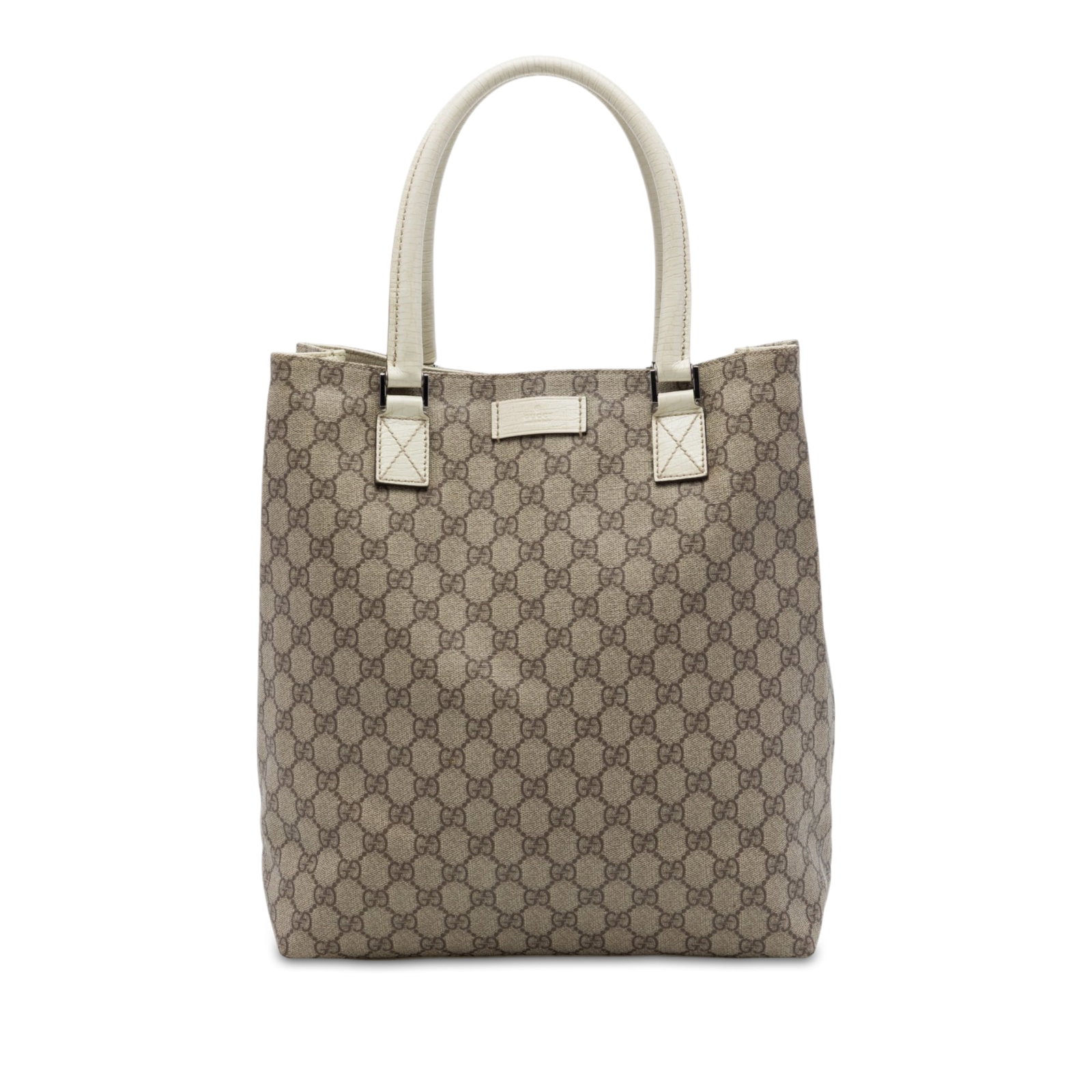 Gucci GG Supreme Coated Canvas Tote Bag Beige: Gucci GG Supreme Coated Canvas Tote Bag Beige A Gucci GG Supreme tote crafted with a coated canvas body and leather trim. It features rolled leather handles, an open top with a magnetic snap closure, 