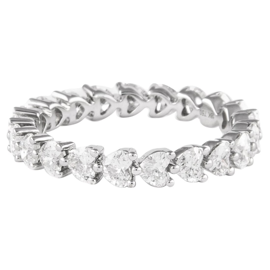 18k White Gold Heart Diamond Eternity Ring 2.15ct Size 7.25: 18k White Gold Heart Diamond Eternity Ring 2.15ct Size 7.25 Heart diamond eternity band set with 21 heart brilliant diamonds totaling 2.15 ct. The diamonds are graded D-F color and VVS2/VS1 clarity. C