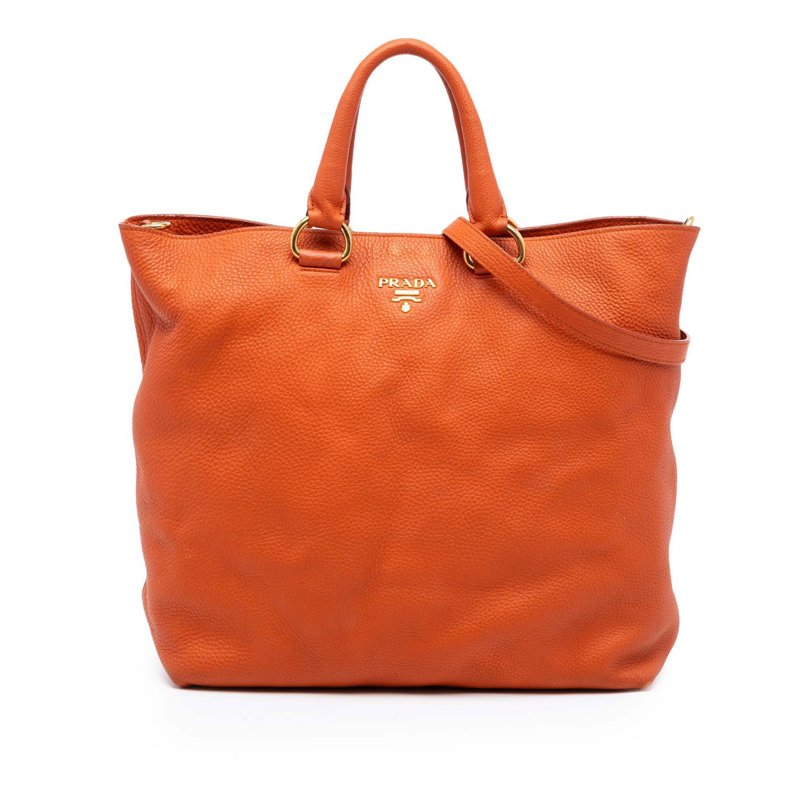 Prada Vitello Daino Orange Leather Convertible Satchel with Detachable Strap: Prada Vitello Daino Orange Leather Convertible Satchel with Detachable Strap This Prada Vitello Daino Open Convertible Tote is crafted from orange vitello daino leather and features rolled leather han