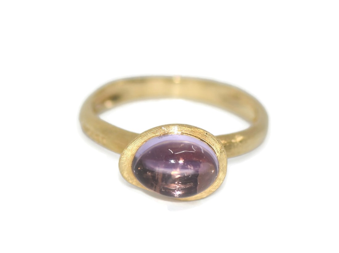 Marco Bicego 18K Yellow Gold Amethyst Ring Size 8: Marco Bicego 18K Yellow Gold Amethyst Ring Size 8 Marco Bicego ring crafted in 18k yellow gold and set with an amethyst. This pre-owned piece is made in Italy and offered in size 8. Specifications Bra