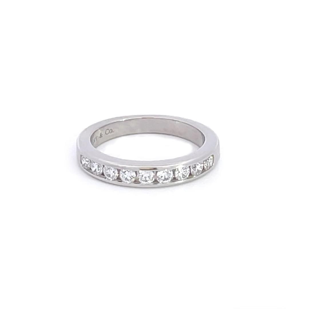 Tiffany Co platinum diamond wedding ring band size 3.75: Tiffany Co platinum diamond wedding ring band size 3.75 Authentic Tiffany & Co. wedding band crafted in platinum with a high polished finish. The front of the band is set with 9 round cut near colorle