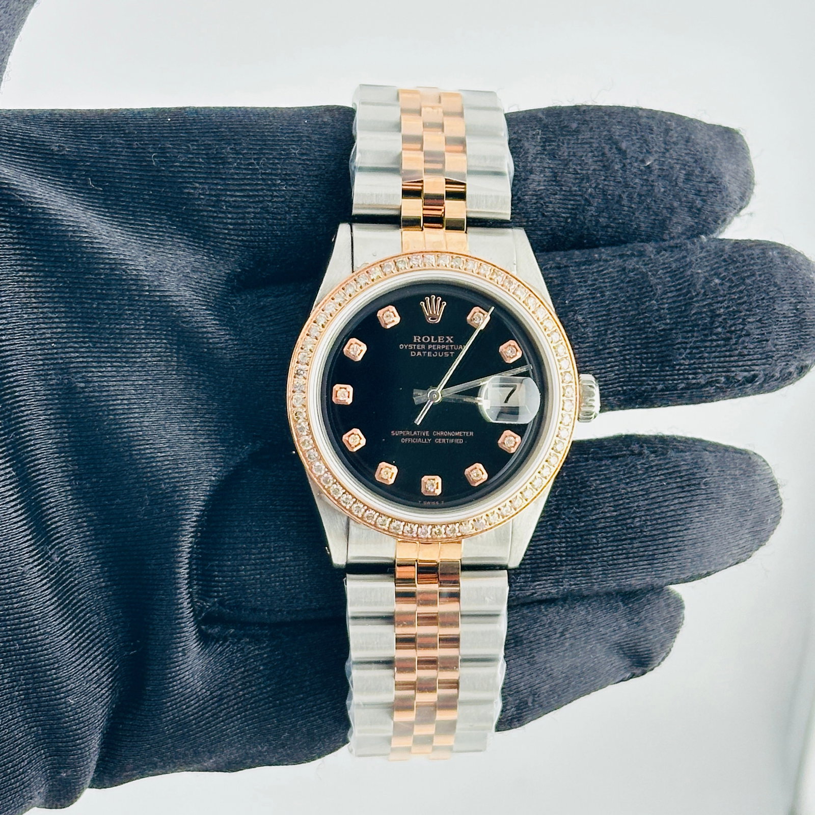 Rolex Datejust Ref. 1601 Mens Watch aftermarket Black Diamond Dial: Rolex Datejust Ref. 1601 Mens Watch aftermarket Black Diamond Dial Rolex Datejust reference 1601 with an Aftermarket black diamond dial, a pave RG plated diamond bezel, and an Aftermarket Jubilee brac