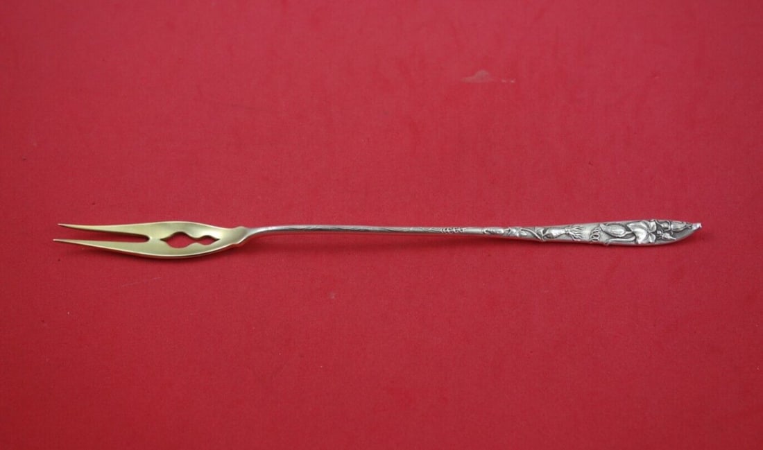 Tiffany Co Vine Sterling Serving Fork 8 1/4 Gold Washed Squash Motif: Tiffany Co Vine Sterling Serving Fork 8 1/4 Gold Washed Squash Motif Sterling silver serving fork in the Vine pattern by Tiffany & Co., featuring a pierced long pickle fork design with a squash motif.