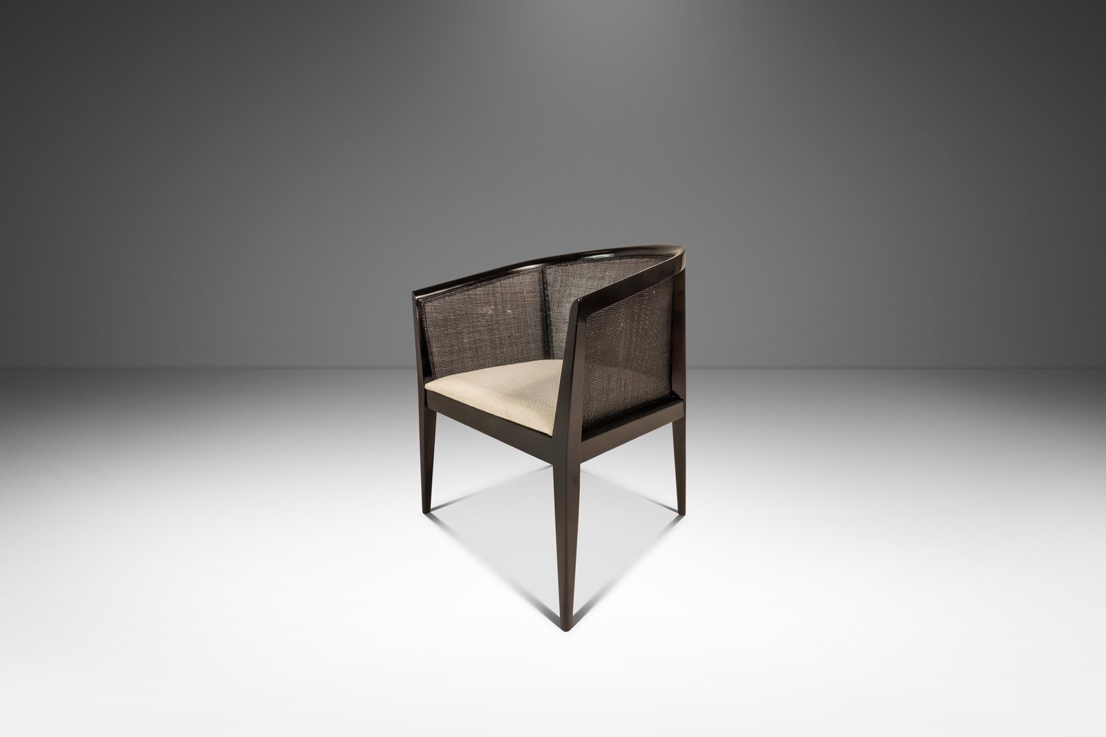 Kipp Stewart Mid-Century Ebonized Caned-Back Lounge Chair for Directional 1950s: Kipp Stewart Mid-Century Ebonized Caned-Back Lounge Chair for Directional 1950s This exquisite Mid-Century Modern lounge chair, designed by Kipp Stewart for Directional in the 1950s, showcases a perfe