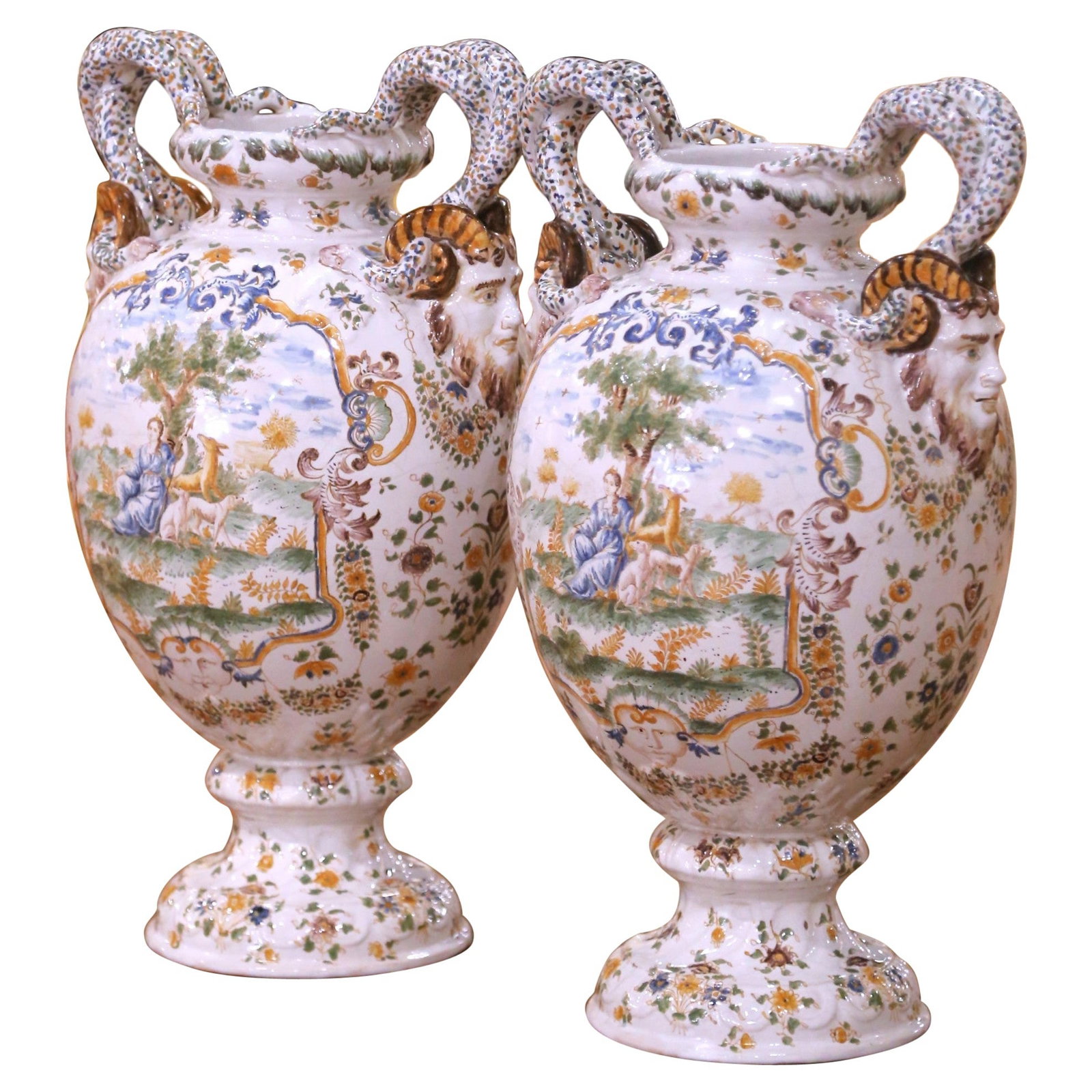 Set of Two French Moustiers Faience Neoclassical Vases with Ram Head Handles: Set of Two French Moustiers Faience Neoclassical Vases with Ram Head Handles This pair of large 19th century French Moustiers faience vases showcases the Neoclassical style, crafted around 1870. Each 