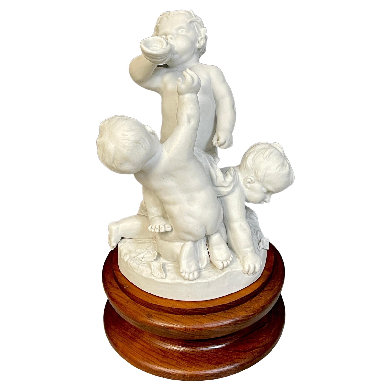 19th Century Sevres Porcelain Biscuit Group of Three Puttos 1884: 19th Century Sevres Porcelain Biscuit Group of Three Puttos 1884 This exquisite 19th Century Sevres biscuit group features three frolicking puttos, showcasing the intricate artistry of the era. Crafte
