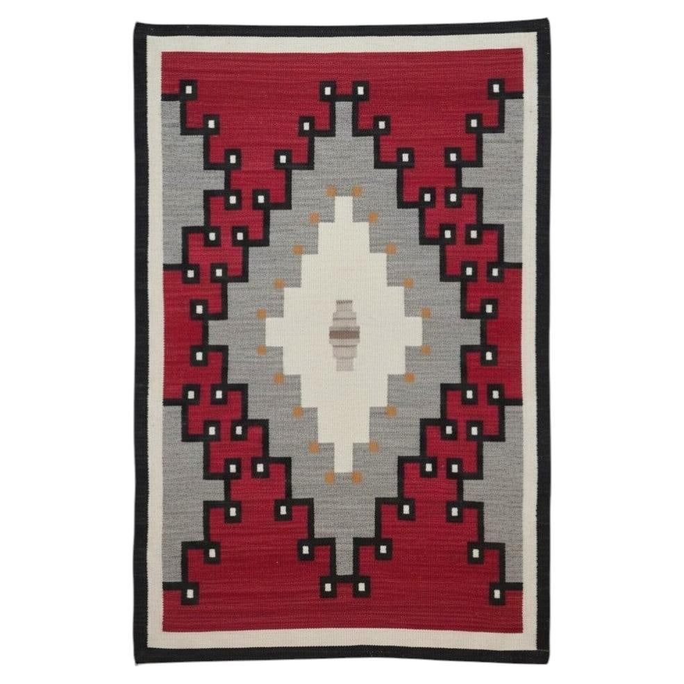 c1920 Navajo Handwoven Wool Rug 66x46 Early 20th Century: c1920 Navajo Handwoven Wool Rug 66x46 Early 20th Century Antique Navajo hand spun and woven wool rug dating to circa 1920. This early 20th century piece features traditional handwoven construction and