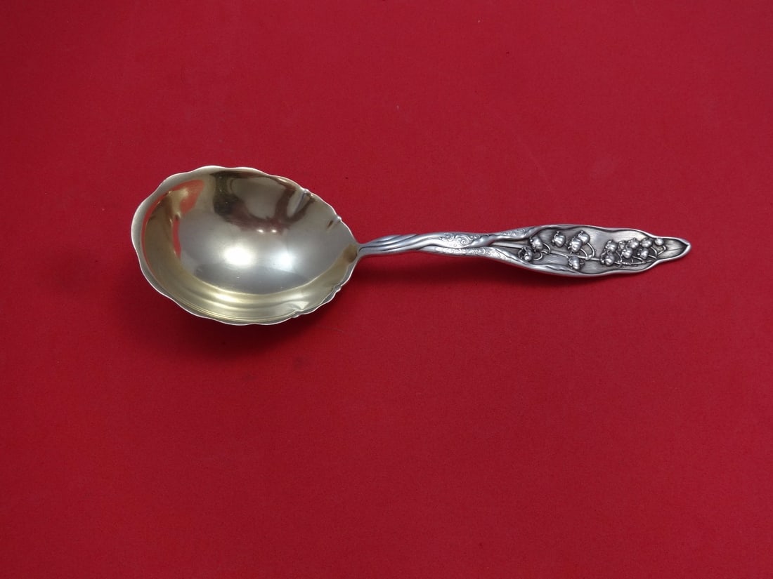 Whiting Lily of the Valley Sterling Silver Berry Spoon Gold Washed 8 3/4: Whiting Lily of the Valley Sterling Silver Berry Spoon Gold Washed 8 3/4 Sterling silver berry spoon in the Lily of the Valley pattern by Whiting, featuring a gold-washed finish. This pre-owned servin
