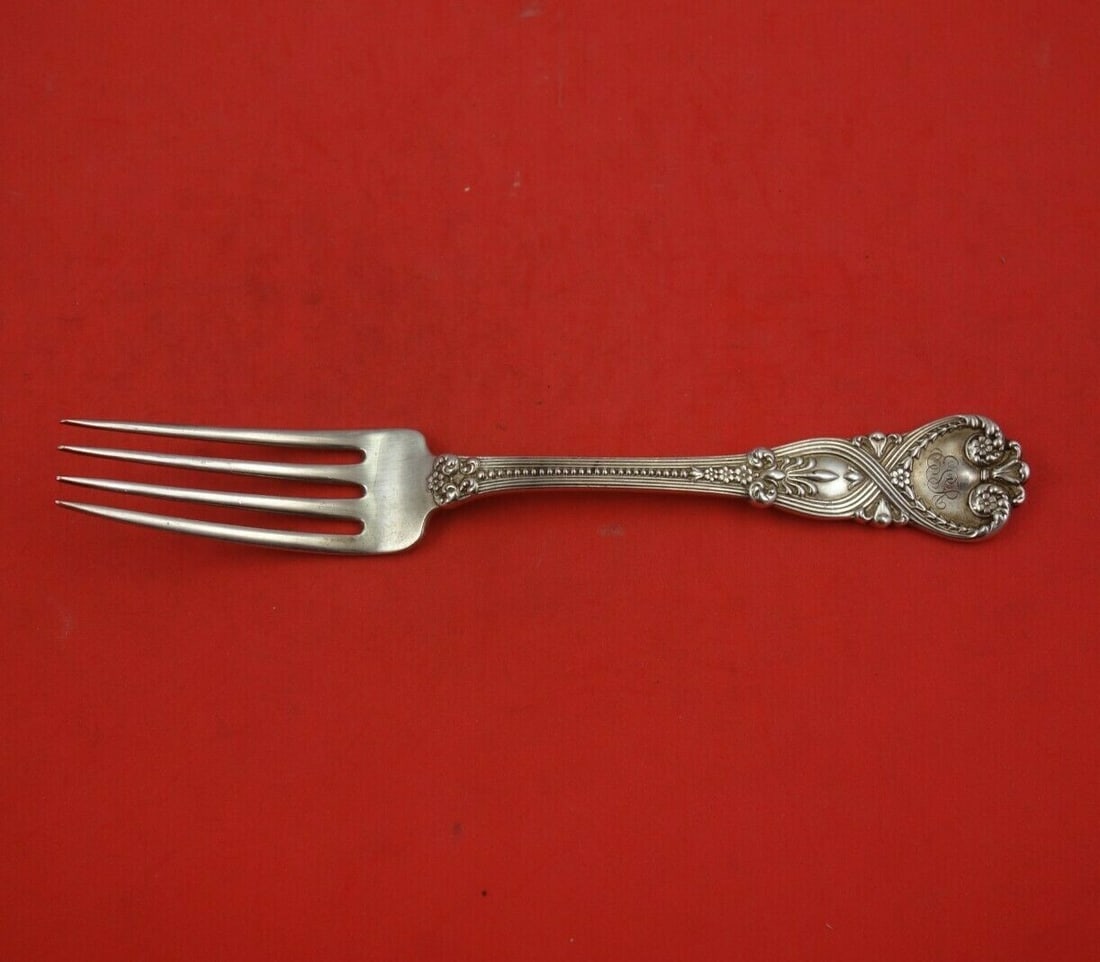 Tiffany Co Saint James Sterling Silver Dinner Fork 7 5/8: Tiffany Co Saint James Sterling Silver Dinner Fork 7 5/8 Sterling silver dinner fork in the Saint James pattern by Tiffany & Co. This pre-owned piece is monogrammed, with monograms that vary, and rema