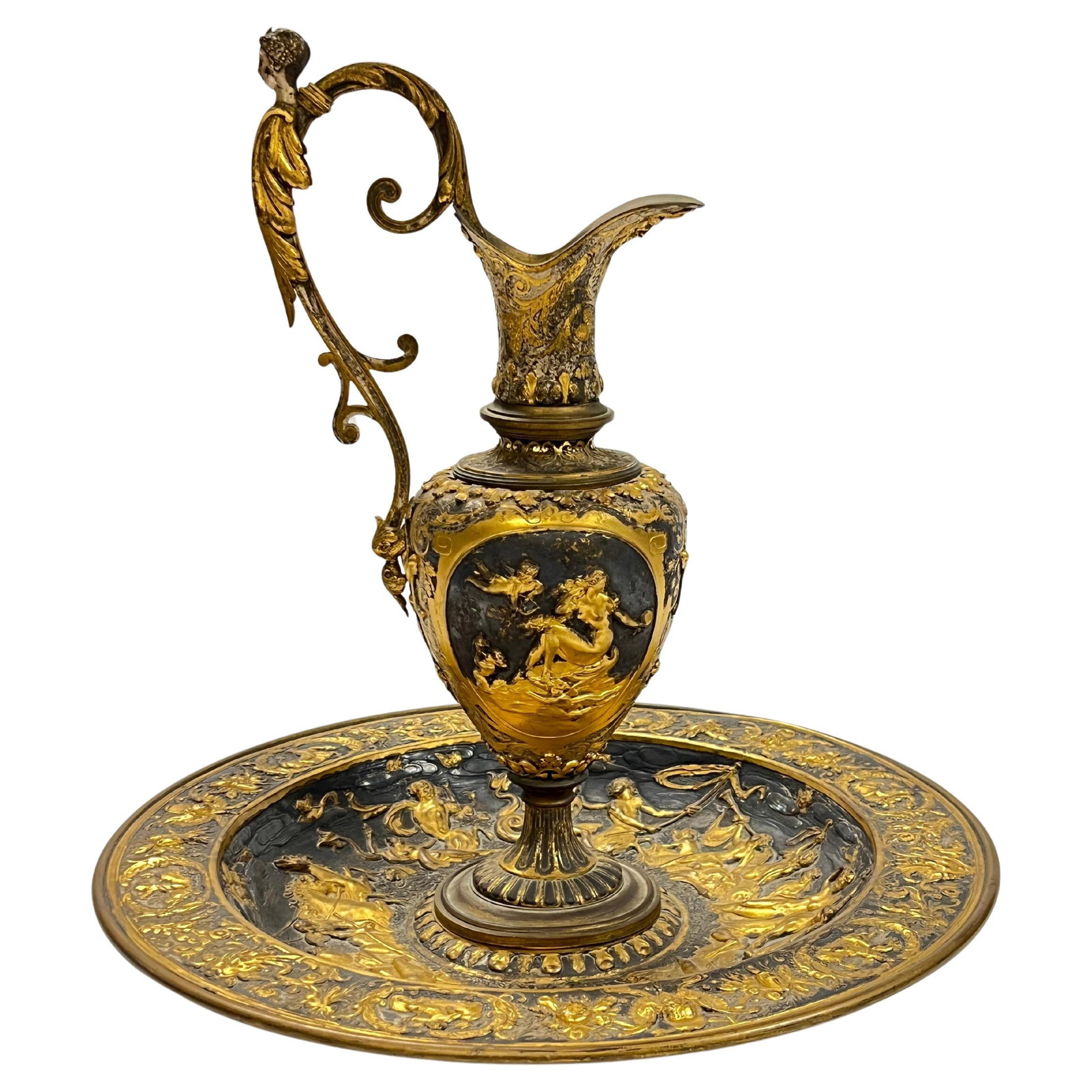 Set of Two French Louis XIII Style Neoclassical Brass Ewer and Basin: Set of Two French Louis XIII Style Neoclassical Brass Ewer and Basin This 19th century French set features a neoclassical ewer and basin crafted in the Louis XIII style. Made from brass with a silvere