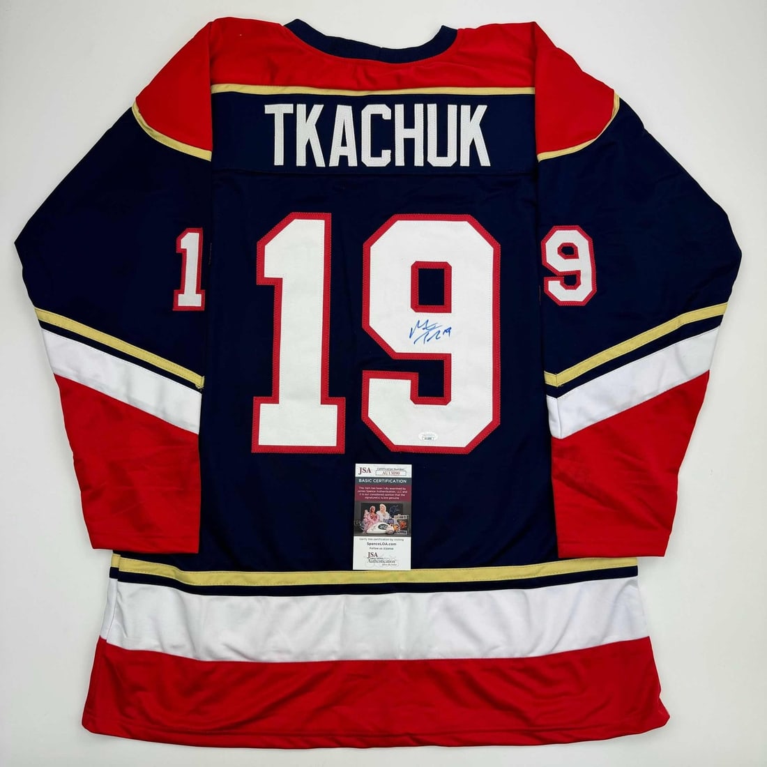 Matthew Tkachuk Signed Custom Florida Panthers Blue Hockey Jersey JSA: Matthew Tkachuk Signed Custom Florida Panthers Blue Hockey Jersey JSA Autographed Matthew Tkachuk blue hockey jersey intended as a collectible display piece. This custom jersey features the player's n