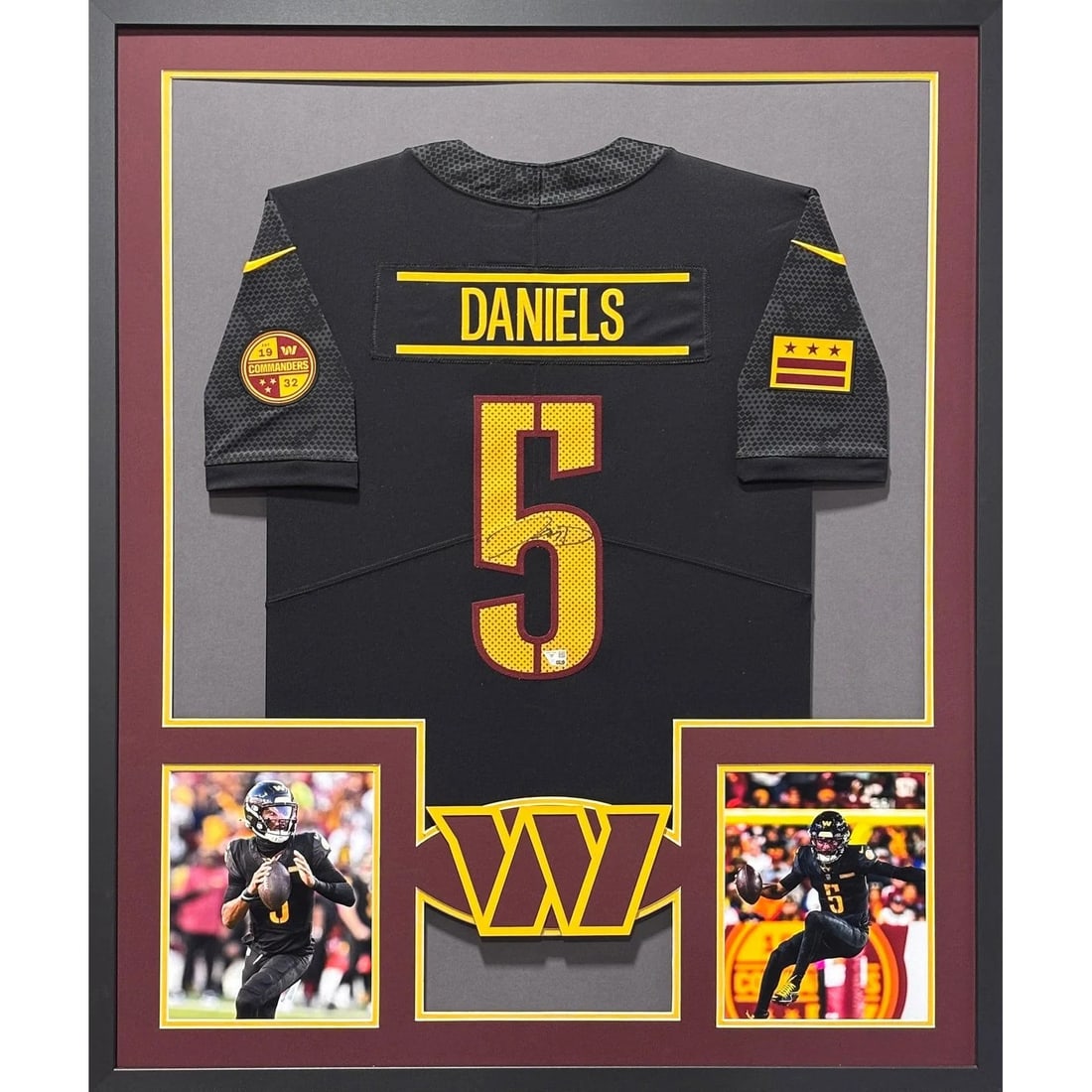 Framed Jayden Daniels Signed Black Commanders Jersey Fanatics Authenticated: Framed Jayden Daniels Signed Black Commanders Jersey Fanatics Authenticated Framed black Jayden Daniels autographed jersey with detailed presentation and a logo display. The piece includes a tamper-pr