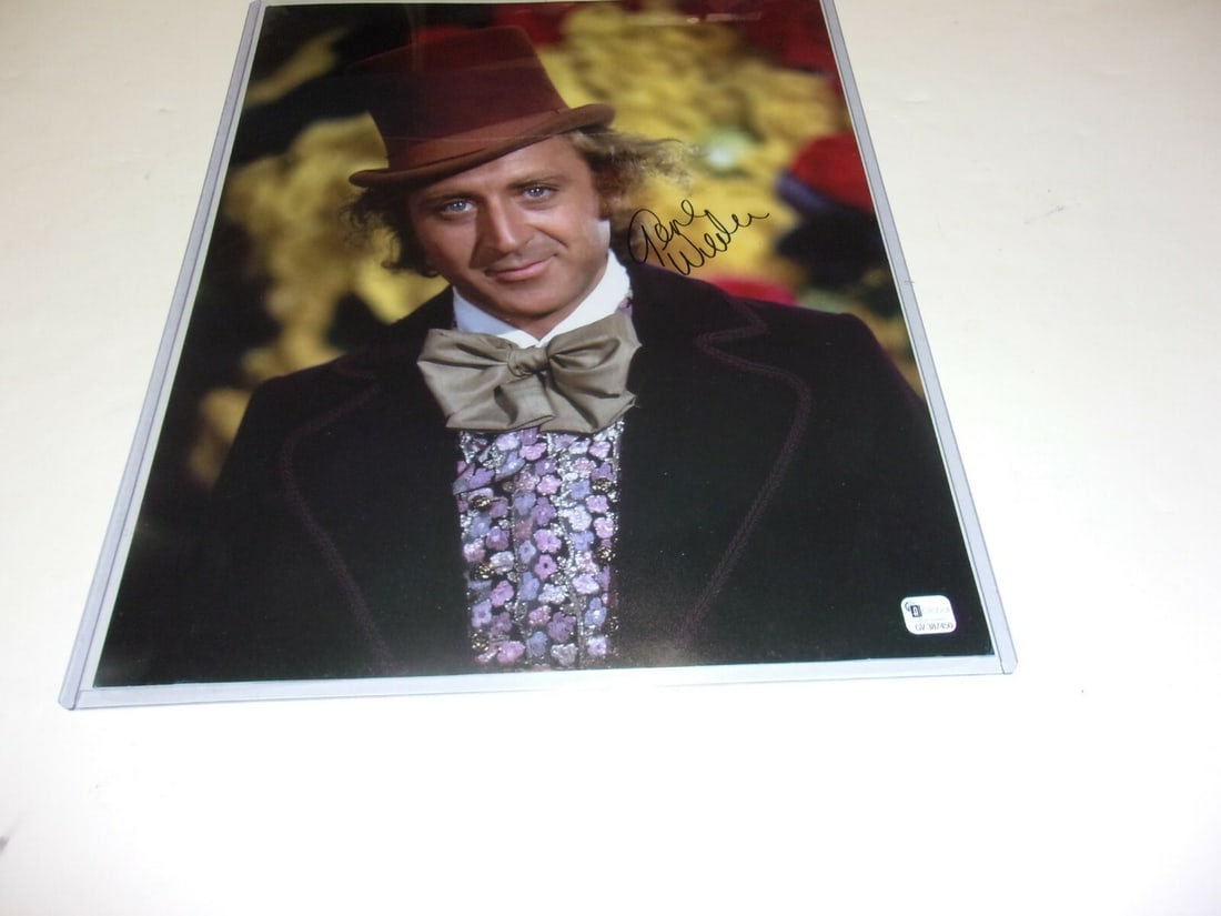 Signed 11x14 Gene Wilder Photograph as Willy Wonka With GAI COA Hologram: Signed 11x14 Gene Wilder Photograph as Willy Wonka With GAI COA Hologram This is an original 11x14 photograph signed by Gene Wilder, known for his iconic role as Willy Wonka. The photo comes with a GA