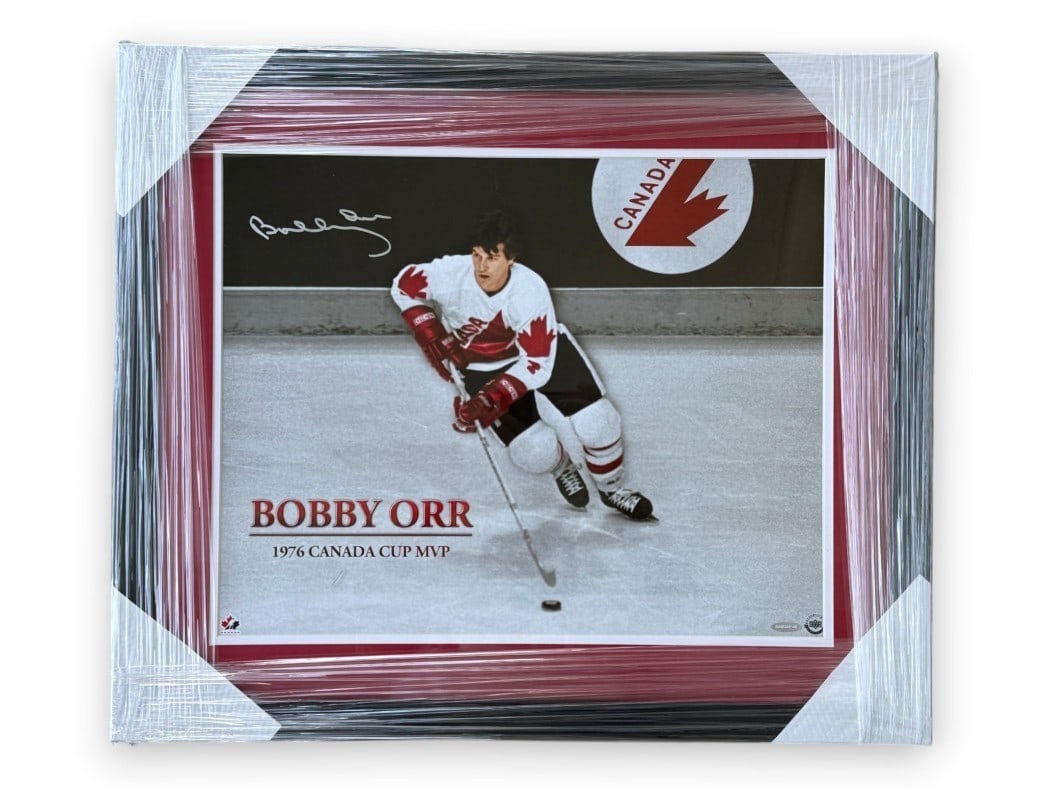 Framed 16x20 Bobby Orr Autographed Canada Photo UDA Authenticated: Framed 16x20 Bobby Orr Autographed Canada Photo UDA Authenticated Framed original 16x20 photograph signed by Bobby Orr, featuring him skating for Canada. This pre-owned piece includes Upper Deck Authe