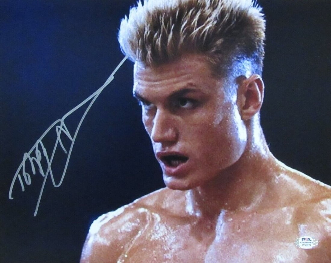 PSA DNA Certified Dolph Lundgren Signed 11x14 Rocky Photo: PSA DNA Certified Dolph Lundgren Signed 11x14 Rocky Photo Autographed 11x14 "Rocky" photo featuring Dolph Lundgren. This original photo is authenticated by PSA/DNA and includes a tamper-proof hologram