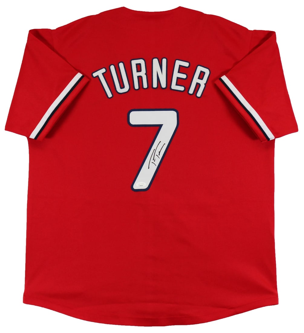Trea Turner Hand Signed Phillies Red Jersey JSA Authenticated: Trea Turner Hand Signed Phillies Red Jersey JSA Authenticated Authentic autographed red pro style jersey personally signed by Trea Turner. This original signed jersey includes JSA authentication with 