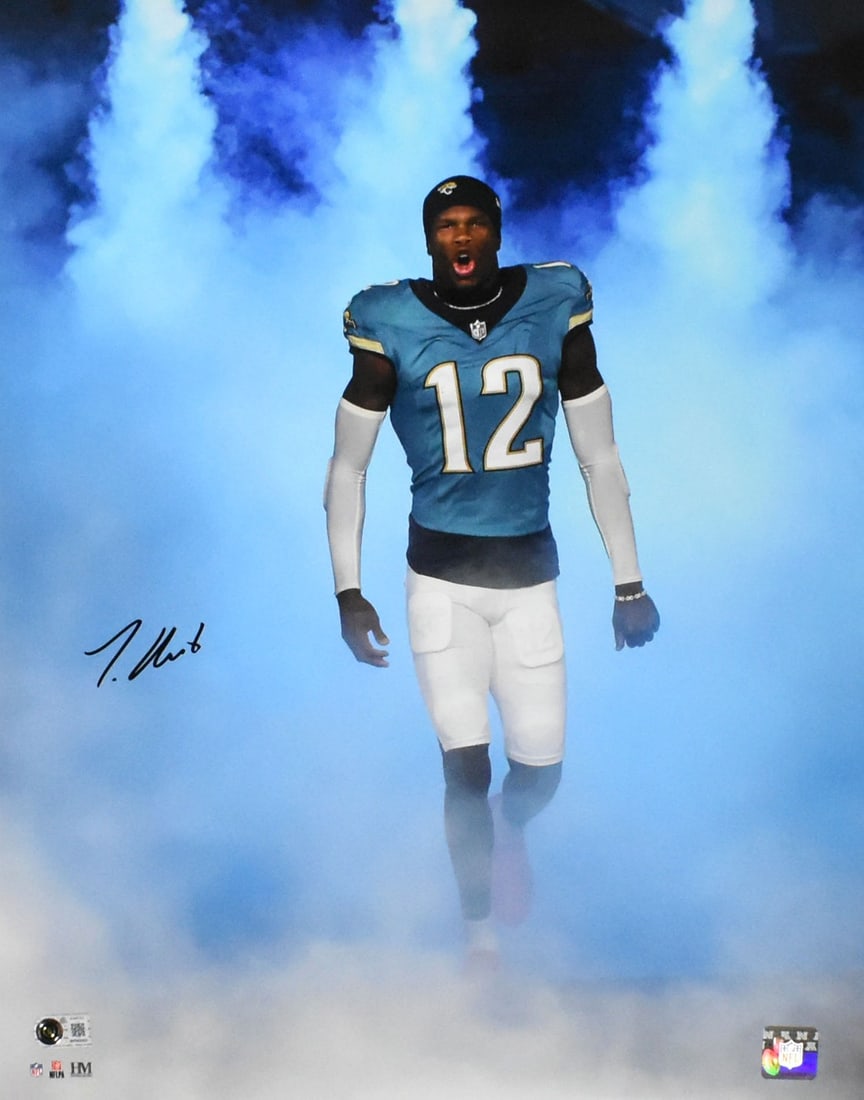 16x20 Jacksonville Jaguars Smoke Photo Signed by Travis Hunter Beckett BAS: 16x20 Jacksonville Jaguars Smoke Photo Signed by Travis Hunter Beckett BAS Autographed 16x20 smoke photo of Travis Hunter featuring Jacksonville Jaguars football imagery. This pre-owned collectible in