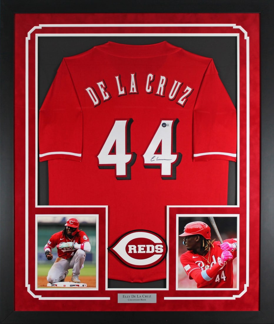 Framed Red Pro Style Jersey Signed by Elly De La Cruz BAS: Framed Red Pro Style Jersey Signed by Elly De La Cruz BAS Authentic signed red pro style framed jersey personally signed by Elly De La Cruz. This original autographed piece is professionally framed an