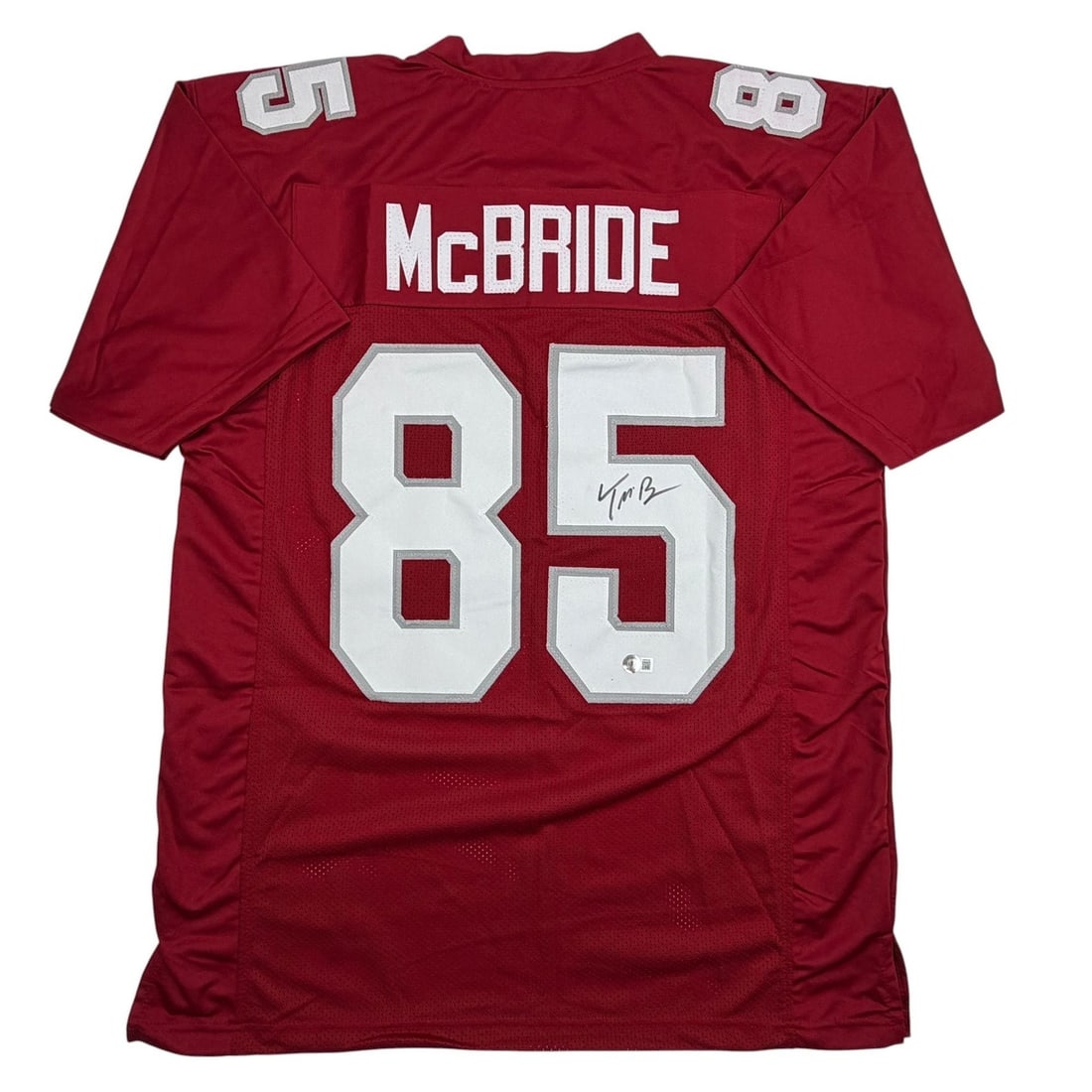 Beckett BAS Certified Trey McBride Signed Red Cardinals Custom Football Jersey: Beckett BAS Certified Trey McBride Signed Red Cardinals Custom Football Jersey Autographed Trey McBride red football jersey intended as a collectible display piece. This custom jersey features the pla