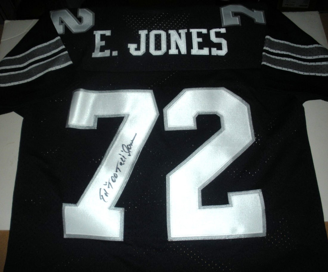 Autographed Dallas Jersey by Ed Too Tall Jones with COA Official Logo Athletic: Autographed Dallas Jersey by Ed Too Tall Jones with COA Official Logo Athletic This is a pre-owned Dallas jersey officially licensed by Logo Athletic, signed by Ed "Too Tall" Jones. The jersey include