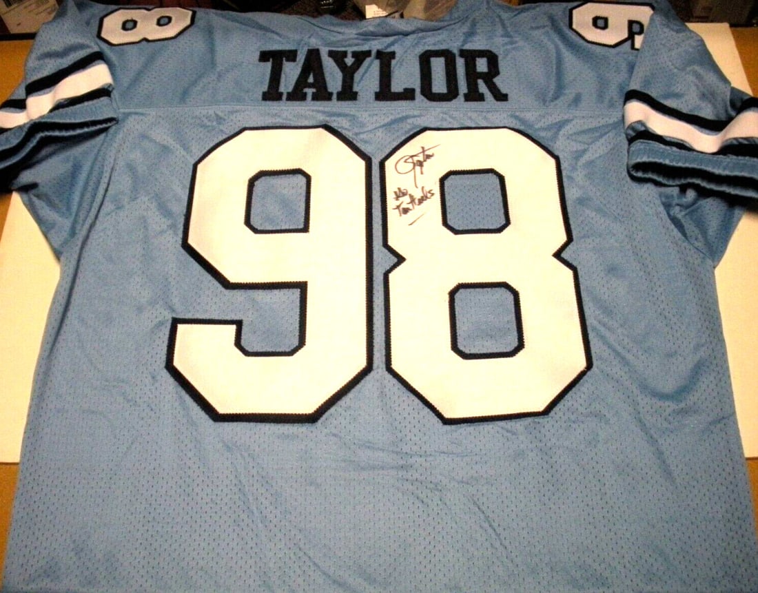 Lawrence Taylor Signed Reebok Jersey with COA North Carolina: Lawrence Taylor Signed Reebok Jersey with COA North Carolina Celebrate the legacy of football legend Lawrence Taylor with this officially licensed Reebok jersey. This pre-owned jersey is a remarkable 